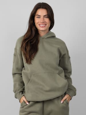 Travel Essentials Hoodie: Lauren is 5’8” and wears a size M