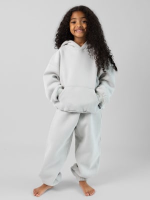 Standard Kids Sweatpants: Malu is 5 wearing a size S