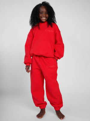 Minimalist Kids Sweatpants: Hattie is 7 wearing a size S