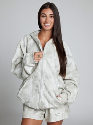 Camo Zip Hoodie: Sara is 5'6" and wears a size M