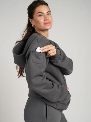 Travel Essentials Zip Hoodie: Lauren is 5'8" and wears a size M